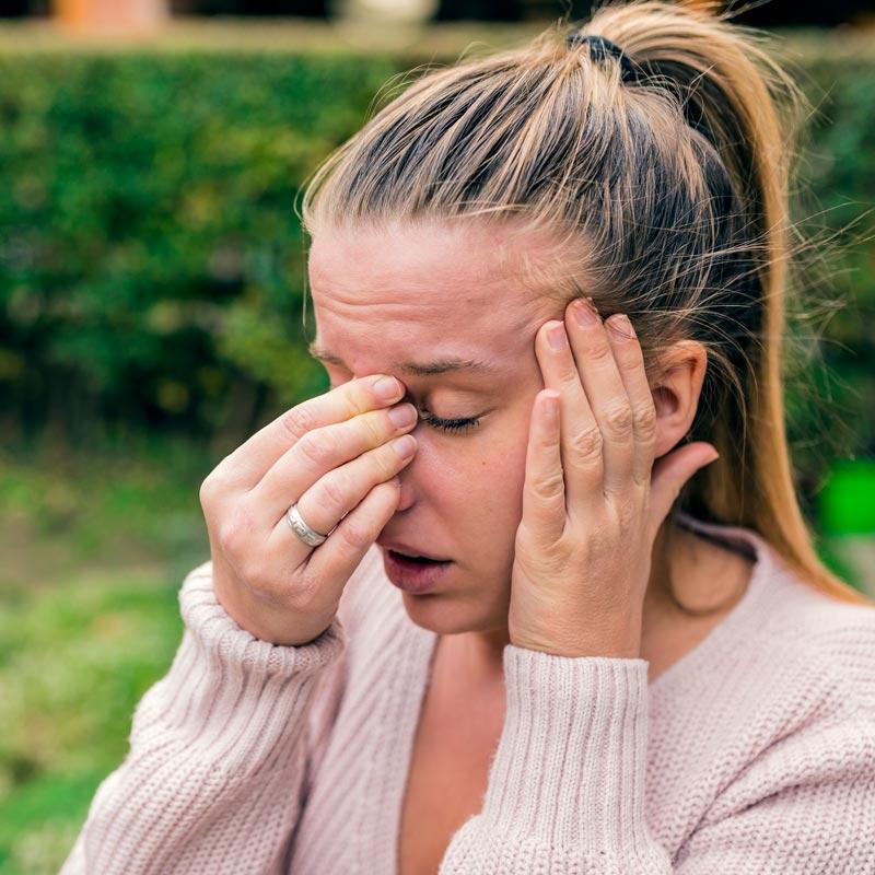 A woman needs in-office sinus solutions from Metro Sinus in St. Peters, MO