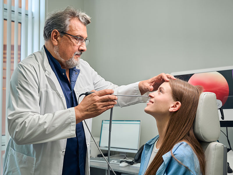 A doctor is clearing the blocked sinus drainage pathways of a woman in St. Peters, MO
